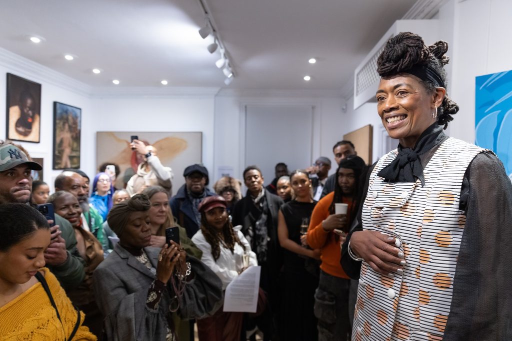 Sukai welcomes visitors to the gallery